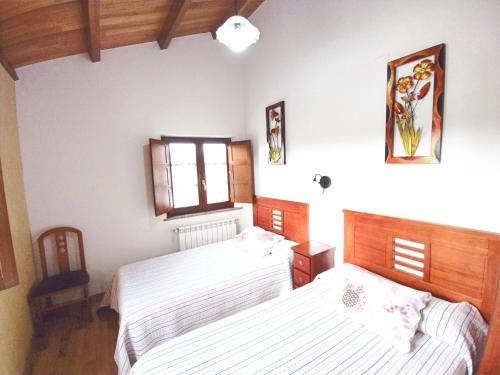 Katil atau katil-katil dalam bilik di Apartamentos Navalin