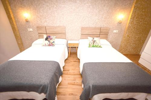 Katil atau katil-katil dalam bilik di Apartamentos Navalin