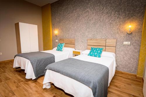 Katil atau katil-katil dalam bilik di Apartamentos Navalin