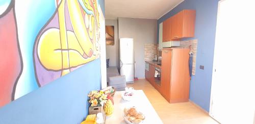 a kitchen with a table with food on it at Villa MiraMar Exclusive Home Palermo Airport in Carini