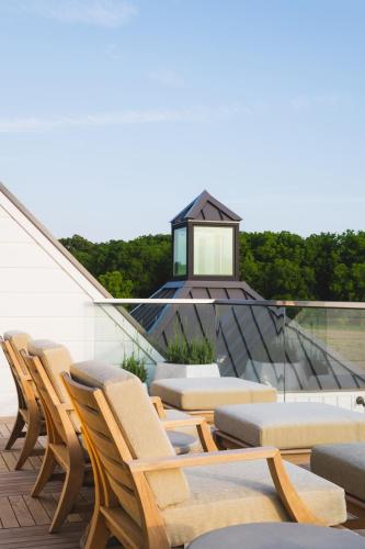 a group of chairs and tables on a roof at Inns of Aurora Resort & Spa in Aurora