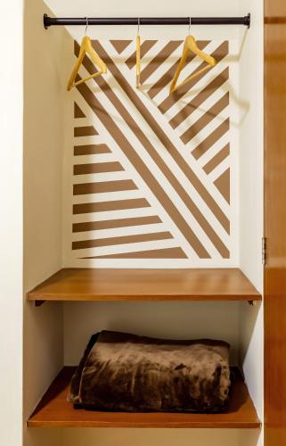 a room with a shelf with a blanket on it at Hotel Rio Blanco in Piura