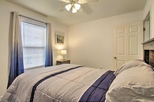 a bedroom with a bed and a window at Pool Access and Fire Pit Ocean Pines Retreat! in Ocean Pines