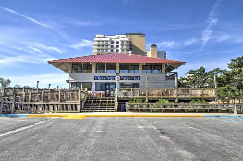 a building with a red roof in front of a street at Pool Access and Fire Pit Ocean Pines Retreat! in Ocean Pines