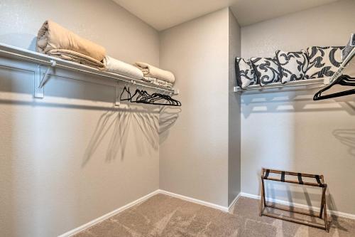 a walk in closet with a mirror and shoes at Dreamy Windsor Home with Grill about 3 Miles to Lake! in Windsor
