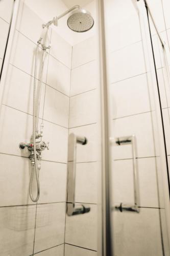 a shower in a bathroom with a glass door at The Swan Hotel in Newport