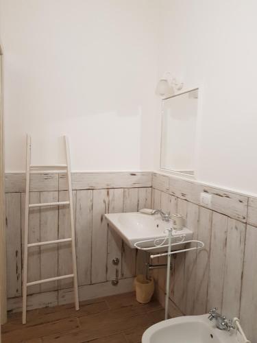 a bathroom with a sink and a mirror at Casale Cisanello in Pisa