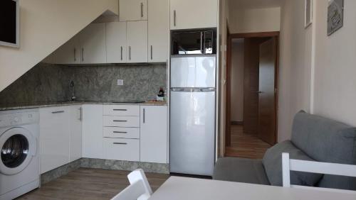 Una cocina o zona de cocina en Apartamentos Aqualecer