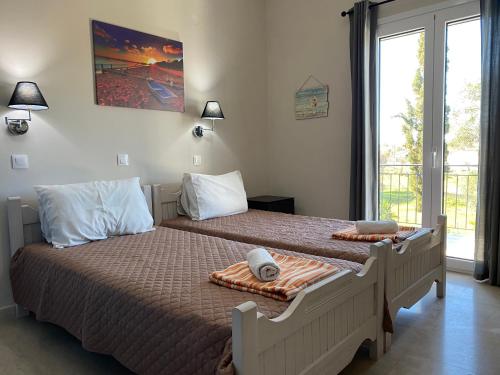 Postel nebo postele na pokoji v ubytování Alexander Apartments