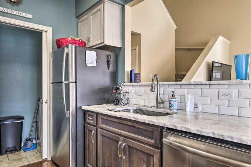 a kitchen with a stainless steel refrigerator and a sink at Walk to Lake Family Gem with Pool Access in Afton in Afton