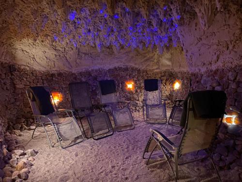 a room with a bunch of chairs and lights at Centrum Rekreacji U Stolema in Ostrzyce