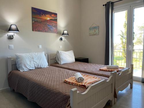 Postel nebo postele na pokoji v ubytování Alexander Apartments