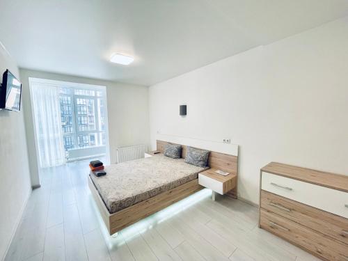 Postel nebo postele na pokoji v ubytování RIVER PARK euro two-roomed flat