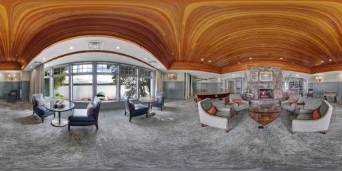a large living room with a wooden ceiling at Mill Falls Resort Collection at the Lake in Meredith