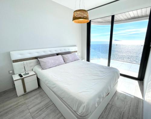 Krevet ili kreveti u jedinici u okviru objekta Exclusive Apartments on the first line of Benidorm Mar y Sol