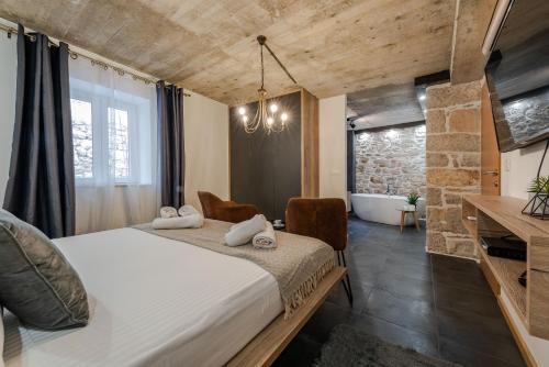 Tempat tidur dalam kamar di Villa Planita Dalmacija