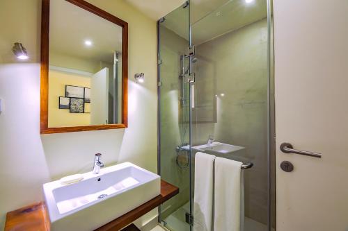 a bathroom with a sink and a glass shower at Sahl Hasheesh,Studio in Veranda, Hurghada in Hurghada