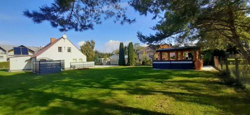 a house with a large yard with green grass at MARINKA Grzybowo in Grzybowo