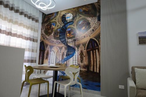 a room with a wall mural of aoration of theorationorationorationorationoration at B&B Acquedotto in Corigliano Calabro