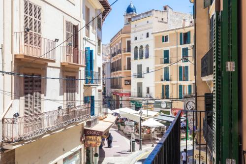 an alley in the city with buildings at Can Boss - Turismo de Interior in Palma de Mallorca
