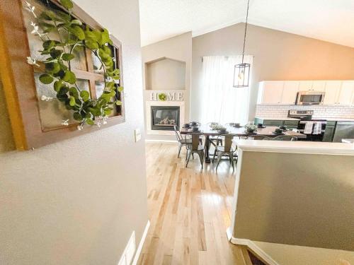 a kitchen and a living room with a dining table at 2 Master Suites! Pet Friendly With MTN Views in Palmer Lake