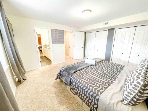 a bedroom with a bed and a walk in shower at 2 Master Suites! Pet Friendly With MTN Views in Palmer Lake