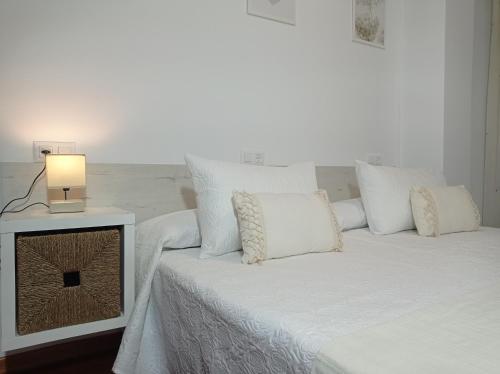 Ένα ή περισσότερα κρεβάτια σε δωμάτιο στο Martínez Rooms Pilgrims