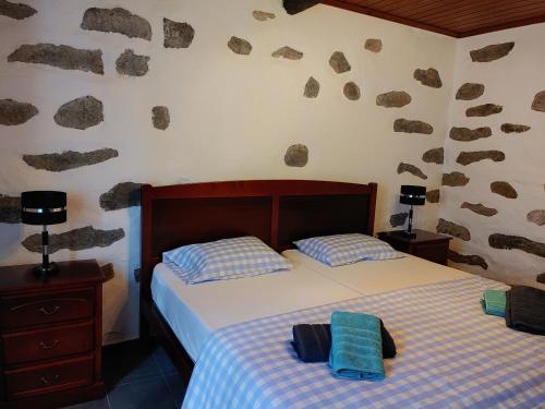 Postel nebo postele na pokoji v ubytování Casinha dos cinco sentidos