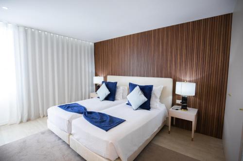 Una cama o camas en una habitación de Hotel Lido