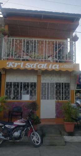 a scooter parked in front of a restaurant at Casa Krisdalia in Moyogalpa