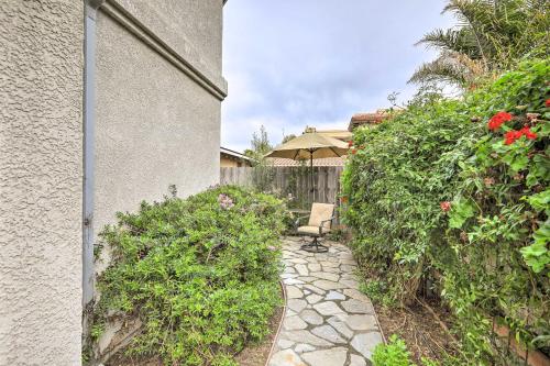 a stone walkway with a chair and an umbrella at Ideally Located Ocean Escape Near Beach and Wineries in Grover Beach