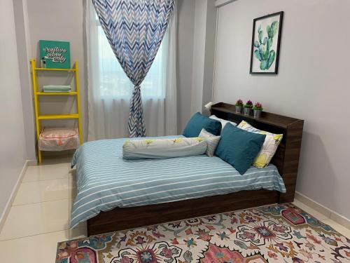 Giường trong phòng chung tại Ammar SkyHome Ipoh