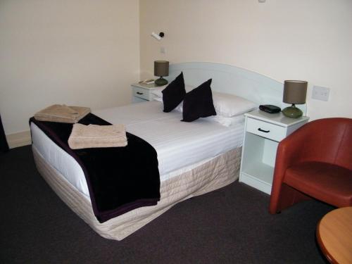 Lova arba lovos apgyvendinimo įstaigoje Grand Tasman Hotel
