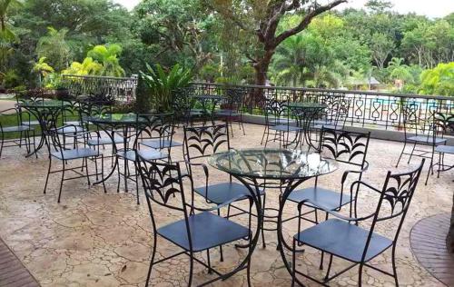 a group of tables and chairs in a patio at Momarco Forest Cove in Tanay