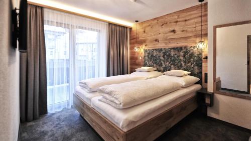 Katil atau katil-katil dalam bilik di A4 AlmA Alpin Appartments