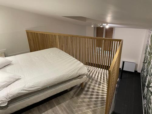 Voodi või voodid majutusasutuse Studio Porte de Gentilly toas