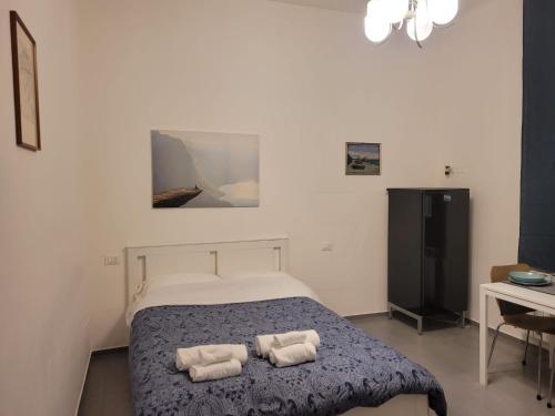 Кровать или кровати в номере Dormi Tranquillo