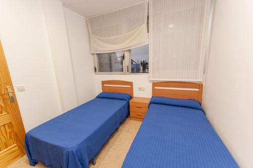 Postel nebo postele na pokoji v ubytování Ermitana 4
