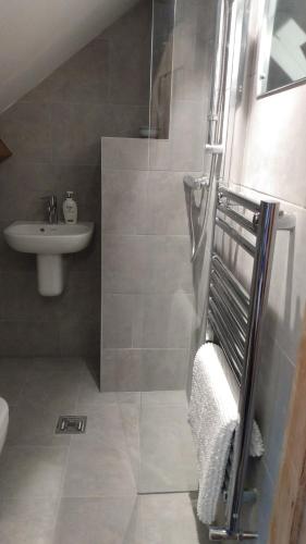 a bathroom with a shower and a sink at Waverley in York