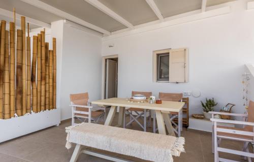 a dining room with a table and chairs at Anemi Suites in Adamas