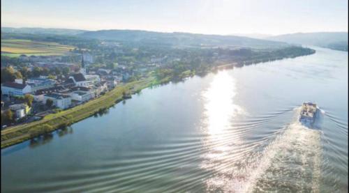 an aerial view of a river with a boat at Pension Artstetten in Artstetten
