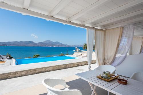 a villa with a view of the ocean at Anemi Suites in Adamas