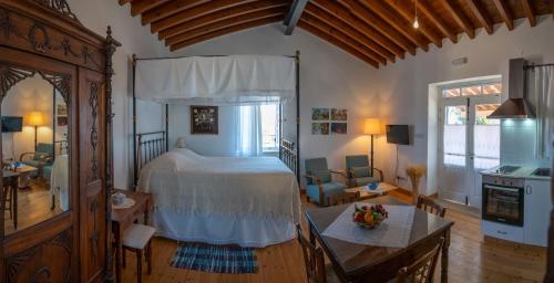a bedroom with a bed and a living room at Rothkia's Home in Parekklisha