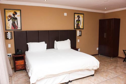 Postel nebo postele na pokoji v ubytování Vahlavi Lodge