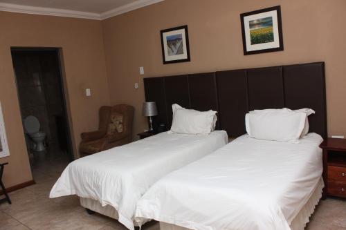 Postel nebo postele na pokoji v ubytování Vahlavi Lodge