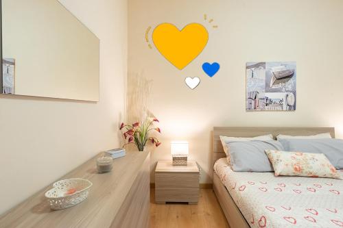 a bedroom with a bed with hearts on the wall at Urban Suite in Cassino