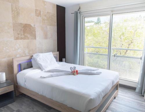 Postel nebo postele na pokoji v ubytování Ti Zion - Studio-Près de la plage By Sister Home