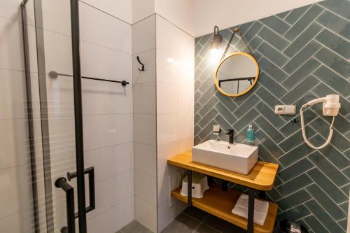 a bathroom with a sink and a shower at Benátky 214 in Vranov nad Dyjí
