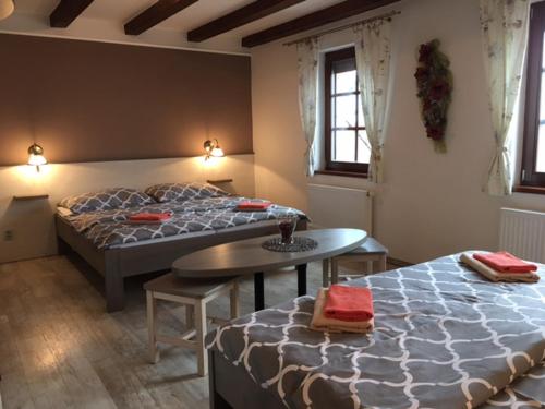 Posteľ alebo postele v izbe v ubytovaní Penzion Villa Alena