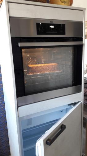 a pizza is baking in an oven at Apartment Am Eck in Schmölln